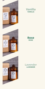 Three scented candles in amber glass jars with vanilla rose and lavender scents detail