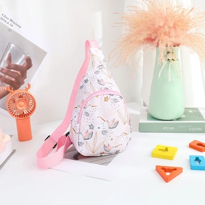 Detail of floral printed nylon kids chest bag with adjustable pink shoulder strap