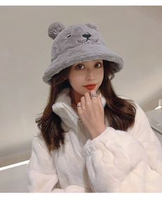 Detail of gray plush teddy bear ear bucket hat with thick thermal faux fur material