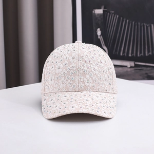 Detailed view of floral lace baseball cap with shimmering multi-colored rhinestones