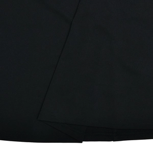 Detailed macro view showing the high-quality fabric texture and stitching of the black dress