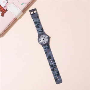 Detail view of quartz watch with blue camouflage resin strap and clear numeric dial