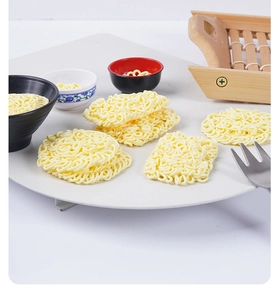 Miniature instant noodle models with realistic textures on white plate for dollhouse
