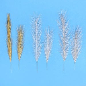 Detail view of 6-piece artificial pampas grass stems in gold and silver for DIY decor