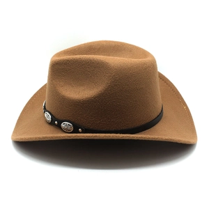 Detail of brown felt cowboy hat featuring black leather band and embossed metal buckle