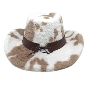 Detailed texture of white and brown cow print faux fur on a Western cowboy hat