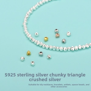 Macro view of S925 sterling silver triangle beads for DIY jewelry in gold and silver