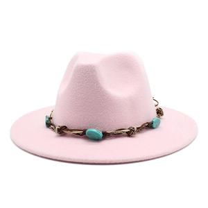 Pink wool felt fedora with bohemian turquoise beaded band on a white background