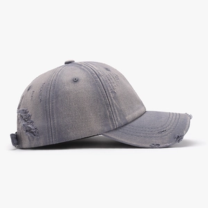 Distressed washed dark grey baseball cap with vintage rips and adjustable soft top crown