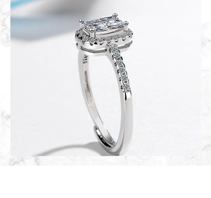 Macro detail of square zircon ring with S925 hallmark on polished silver band