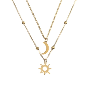 Detail of double-layer gold necklace featuring sun and moon pendants with golden beads