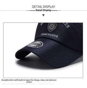 Detail view of the breathable mesh fabric and stiff brim on the navy blue baseball cap