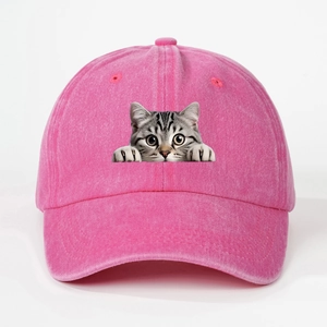 Detailed view of pink washed denim baseball cap with funny tabby cat print design
