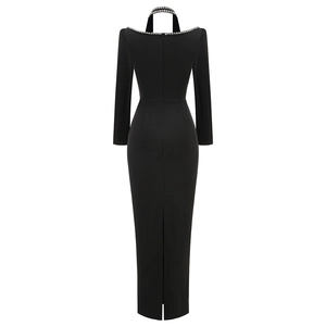 Back view of a sleek black halter neck evening gown with sparkling rhinestone details
