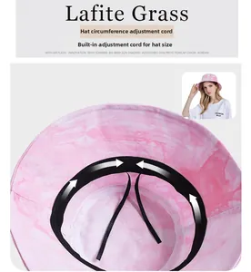 Detail of adjustable inner drawstring for custom fit on pink tie-dye bucket hat