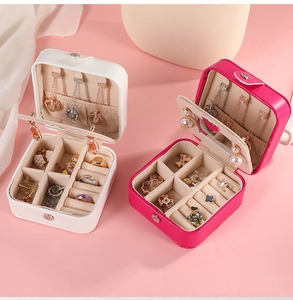 Detailed view of the multi-slot interior and storage layers of the portable PU jewelry box