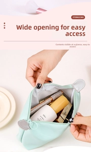 Detail of mint green PU makeup bag showing large opening and spacious cosmetic storage