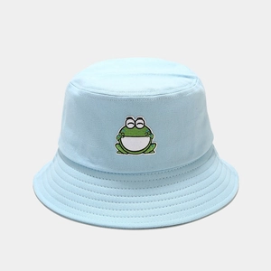 Detail showing high-quality cartoon frog embroidery on light blue cotton bucket hat