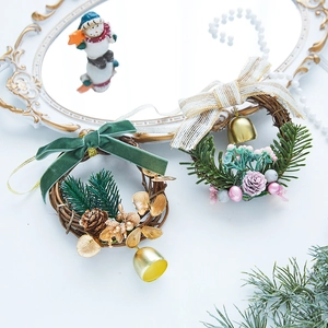 Christmas wreath ornaments with velvet bows and golden bells on a festive background