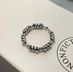 Macro view of vintage 925 sterling silver ring with textured twisted rope details
