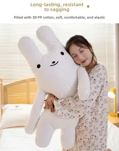 Close-up of textured bean velvet fabric and 3D PP cotton filling on long bunny pillow