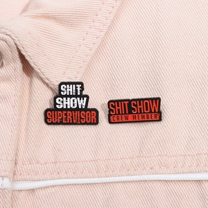 Black enamel pins set with humor text on pink denim jacket for funny accessory style