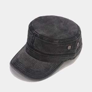 Detail of vintage washed cotton military hat showing metal vents and stitched seams