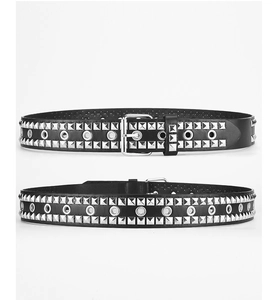 Close-up of punk style black PU leather belt with silver square rivets and metal eyelets