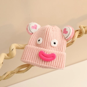Bonnet tricoté rose pour enfants avec yeux et bouche de dessin animé et oreilles 3D
