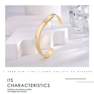 Detailed view of irregular gold-plated cuff featuring sharp edges and mirror finish