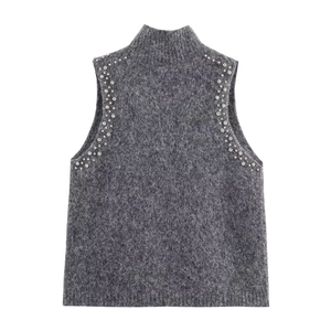 Grey sleeveless knit vest with high collar and rhinestone shoulder details on plain white background