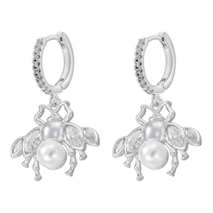Close-up of bee earrings with pearl bodies and marquise zircon wings in silver