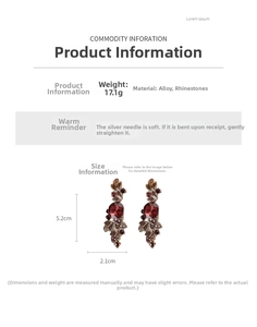 Detail showing vintage leaf earrings size 5.2x2.1cm and weight 17.1g with ruby rhinestones