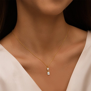 Elegant model shot of a gold S925 silver necklace with rectangular zircon pendant