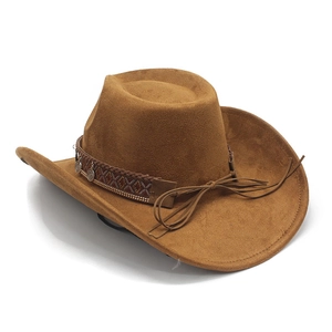 Detail of a brown cowboy hat featuring an ethnic woven band with vintage metal coins