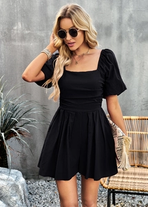 Detail of square neck and puff sleeves on black short sleeve wide-leg romper for women