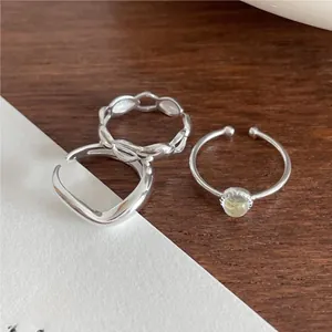 Detailed macro shot of 925 sterling silver ring set with braided and gemstone accents