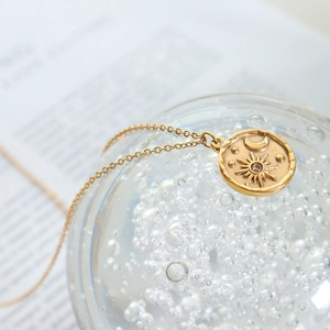 Minimalist gold plated stainless steel sun and moon necklace with sparkling zircon stone