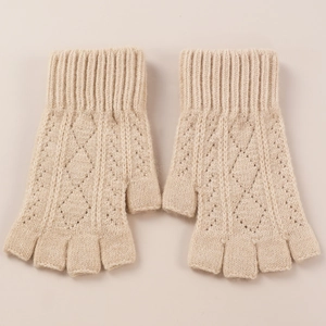 Detailed view of beige diamond knit fingerless gloves with soft wool texture and ribbed cuffs