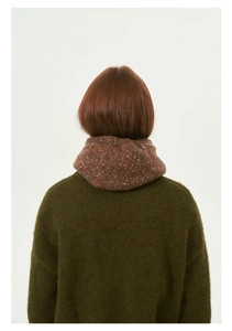 Detailed back view of a brown speckled knit balaclava with colorful flecks and sweater