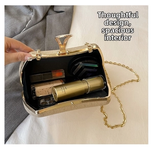 Internal view of gold sequin clutch bag showing storage for phone and cosmetics