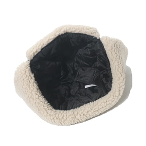Detail of the warm lamb wool lining and quilted interior of this winter trapper hat