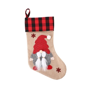 Linen Christmas stocking with gnome motif and red black checkered cuff decoration
