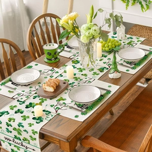St. Patrick's Day table runner and place mats with green clover patterns and lucky text