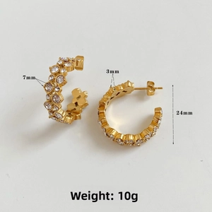 Close-up showing 24mm diameter and 7mm width dimensions of gold C-shape zircon earrings