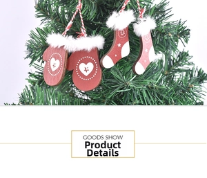 Detail of wooden Christmas ornaments featuring red gloves and socks on a tree