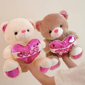 Cute cream and brown plush teddy bears holding pink LOVE hearts for kids gift