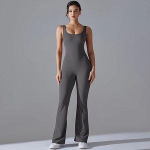 Detail of dark grey slim fit yoga jumpsuit with flare leg design and racerback top