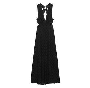 Detail of black hollow embroidery on a V-neck maxi dress with side cut-outs and backless design