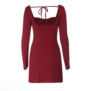 Detail showing burgundy ribbed texture and lace-up back design of the bodycon dress